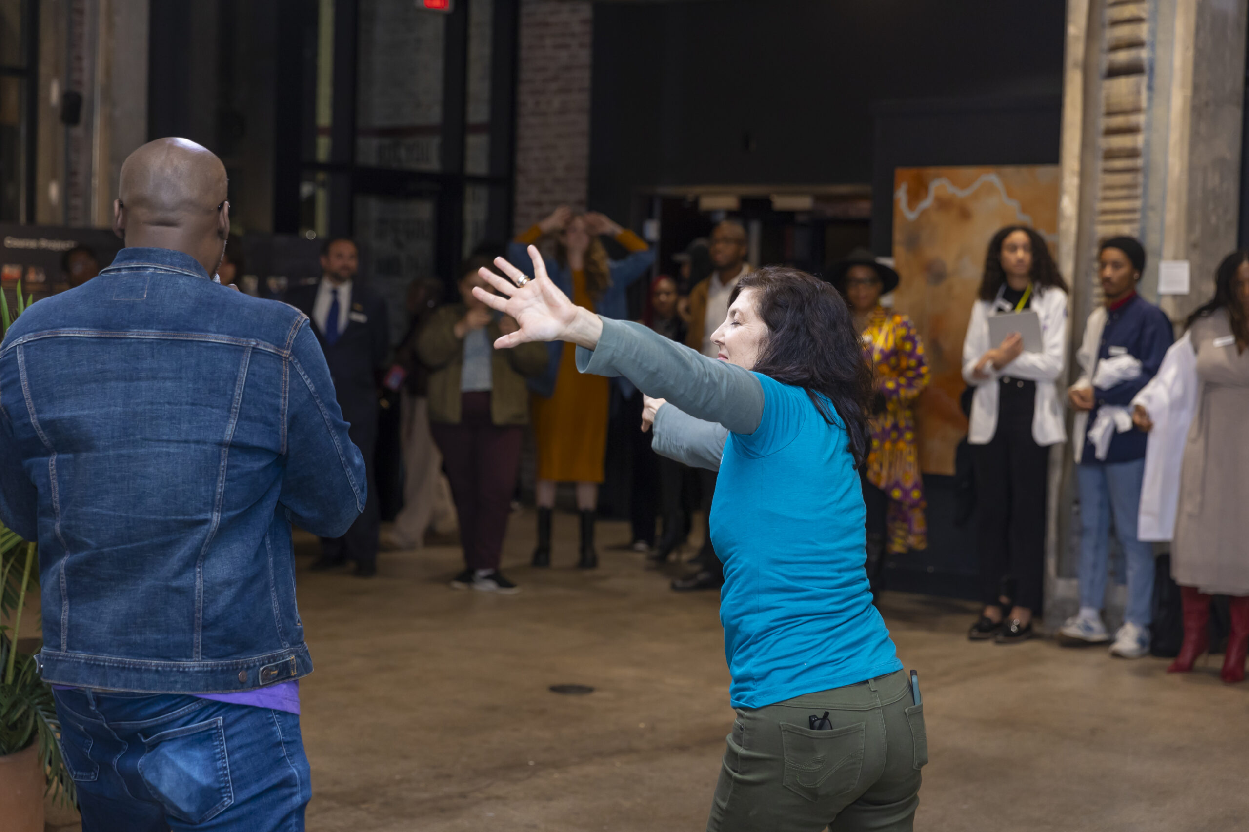 Lori Teague is in syc with her collaborator, Antonio David Lyons, as he invites the audience to participate.