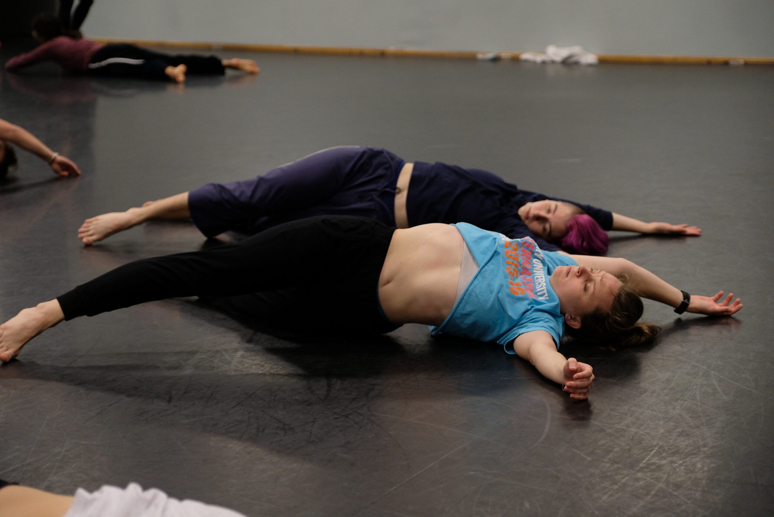 Dance majors explore cross-lateral spirals and patterning across the floor.